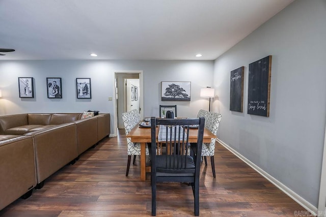 dining space featuring dark wood-type flooring