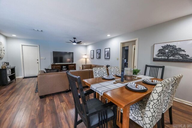 dining area featuring ceiling fan and dark wood-type flooring