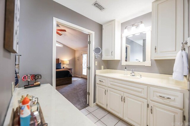 bathroom featuring ceiling fan, tile patterned floors, and vanity