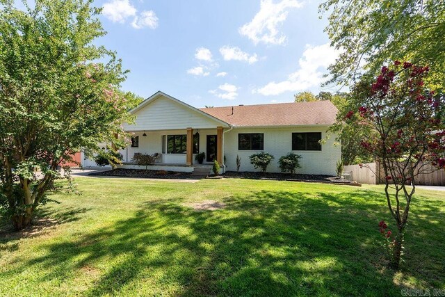 view of front facade with a garage and a front lawn