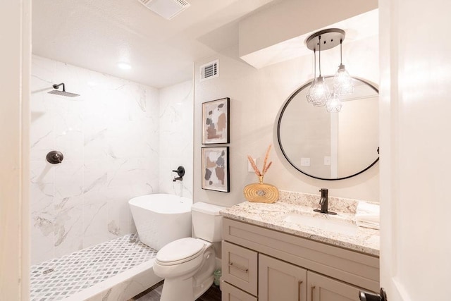 bathroom featuring toilet, a shower stall, visible vents, and vanity