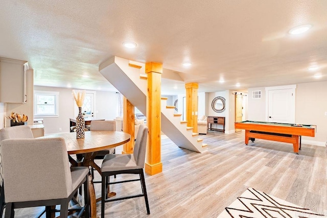 rec room with visible vents, light wood-style flooring, a textured ceiling, billiards, and baseboards