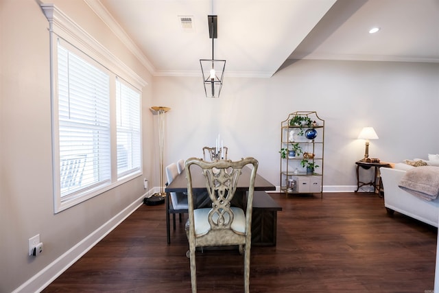 dining room with ornamental molding and dark wood-type flooring