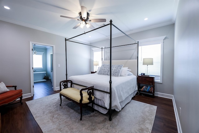 bedroom with ornamental molding, dark wood-type flooring, ceiling fan, and ensuite bath