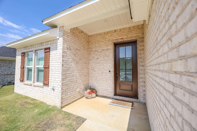 property entrance with a patio