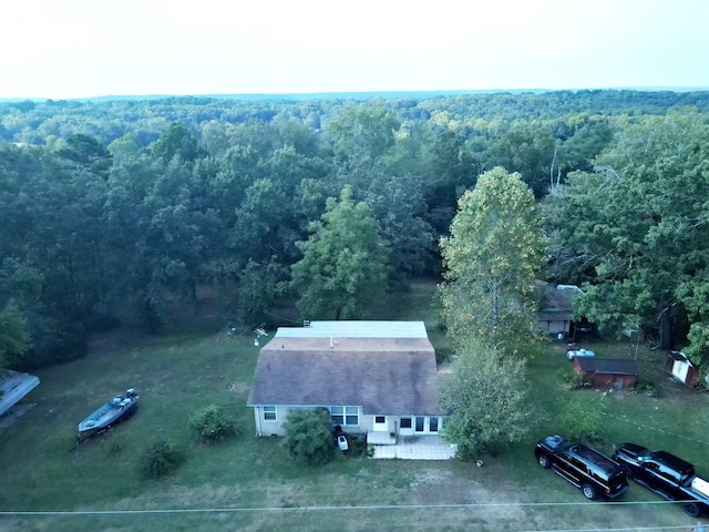 drone / aerial view featuring a view of trees