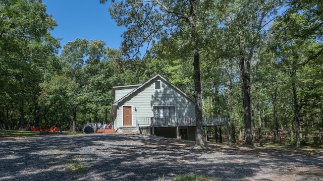 view of side of property with a wooden deck