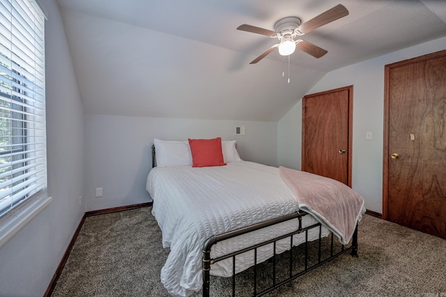 carpeted bedroom with ceiling fan and lofted ceiling