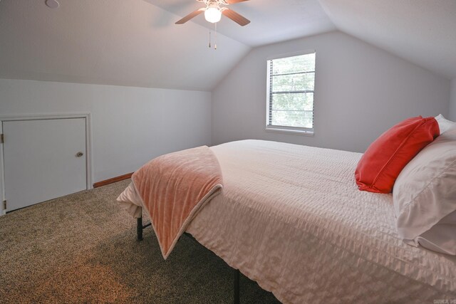 bedroom with ceiling fan, carpet, and lofted ceiling