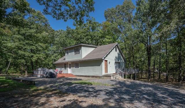 view of side of home with a deck