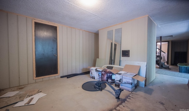 miscellaneous room featuring concrete floors and a textured ceiling