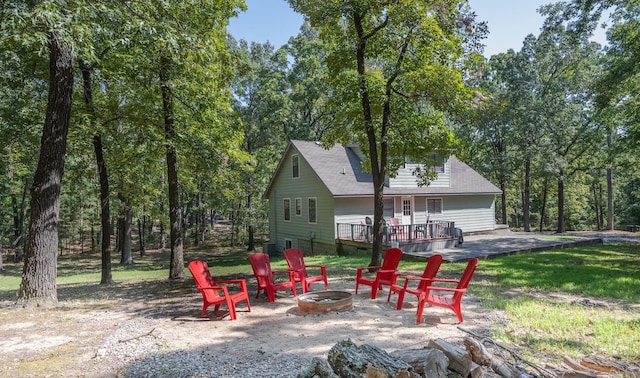 exterior space featuring a deck and a fire pit