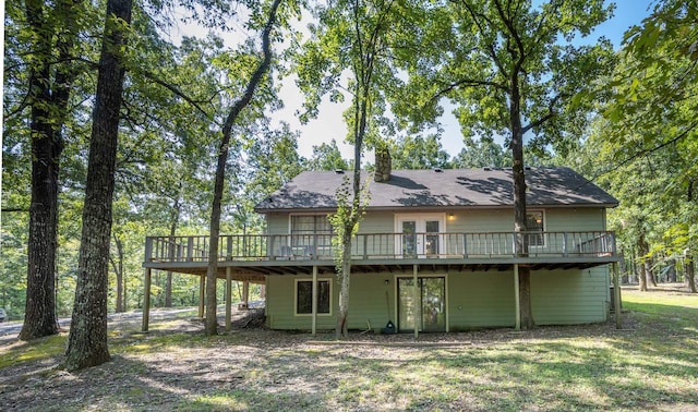 back of property with a wooden deck