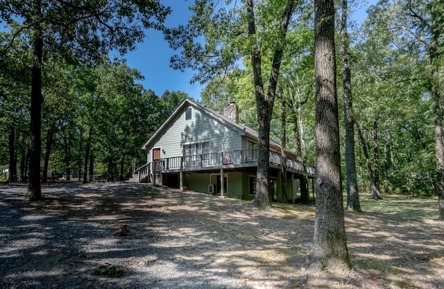 view of home's exterior featuring a wooden deck