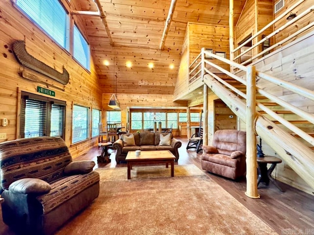 living room with high vaulted ceiling, wooden walls, wooden ceiling, and wood-type flooring