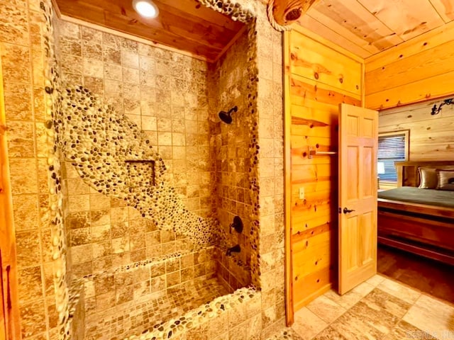 bathroom with wood walls, wood ceiling, and tile patterned flooring