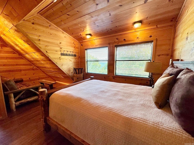 bedroom featuring wooden ceiling, vaulted ceiling, hardwood / wood-style flooring, and wood walls