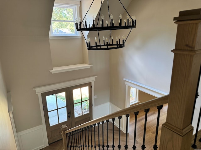 staircase with hardwood / wood-style floors