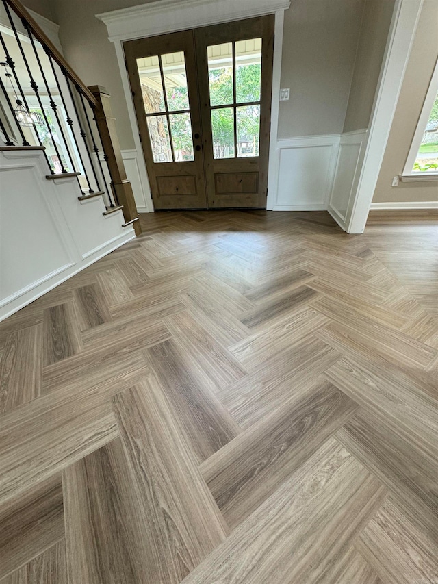 interior space featuring light parquet flooring and french doors