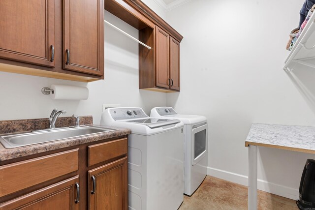 1312 Stone Creek Ln, Jonesboro, AR 72401 - laundry area with ornamental molding, sink, washing machine and dryer, cabinets, and light tile patterned floors