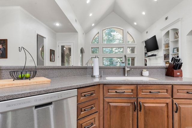 kitchen featuring lofted ceiling, sink, and dishwasher