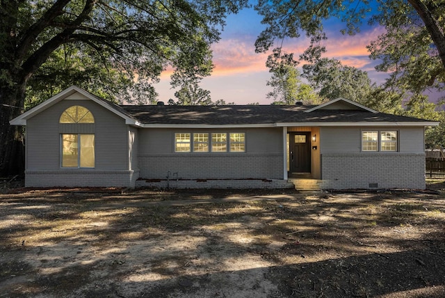 single story home with brick siding and crawl space