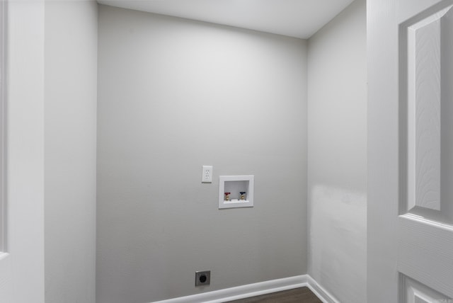 laundry area with hookup for a washing machine, hookup for an electric dryer, wood finished floors, laundry area, and baseboards