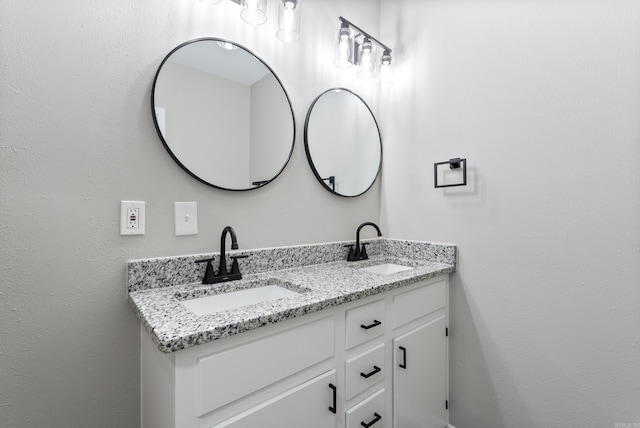 bathroom with double vanity and a sink