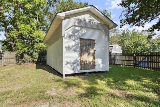 view of shed featuring a fenced backyard