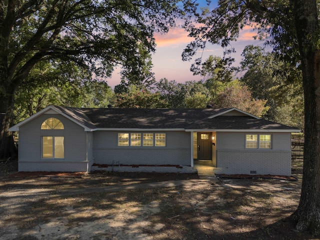 ranch-style house with brick siding and crawl space