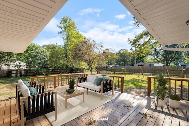 deck with a fenced backyard and a lawn