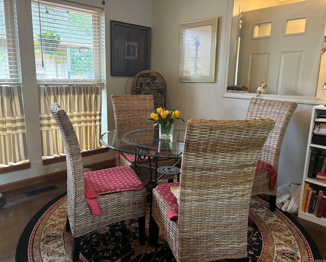 dining room with hardwood / wood-style floors