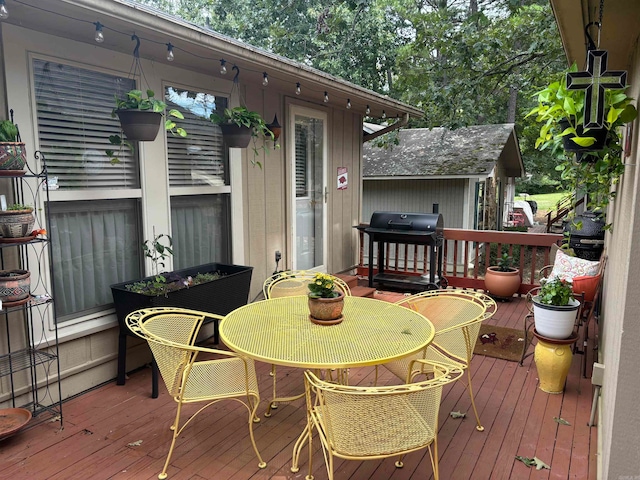 wooden deck featuring area for grilling