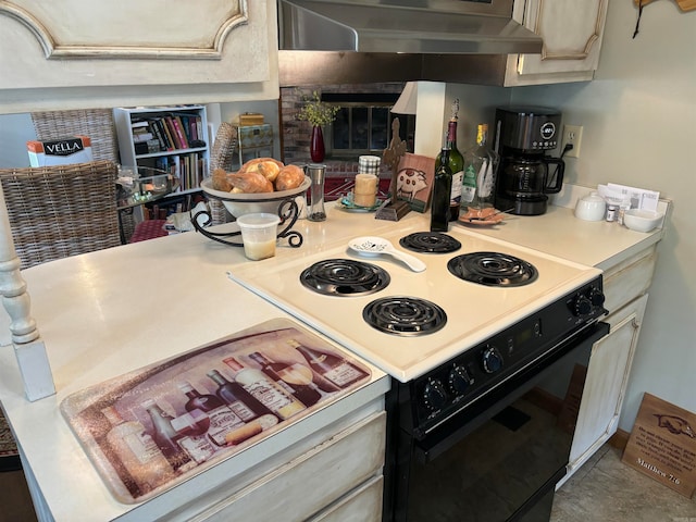 kitchen with wall chimney range hood and white electric stove