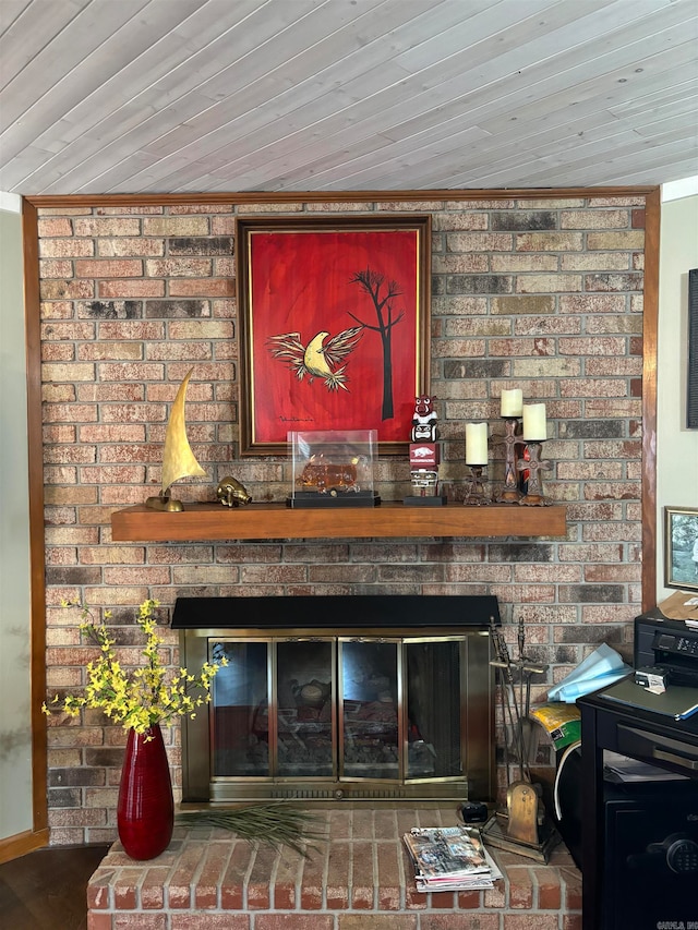 details featuring wooden ceiling and a brick fireplace