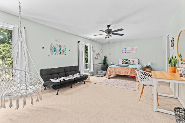 bedroom featuring carpet floors and multiple windows