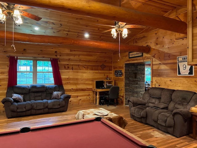 living room with ceiling fan, billiards, wood walls, and hardwood / wood-style floors