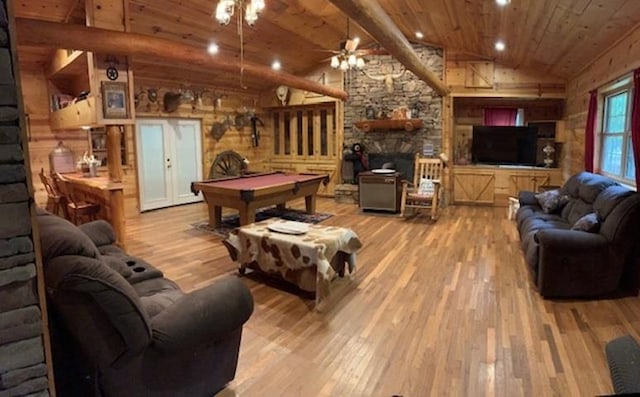 living room with ceiling fan, billiards, light hardwood / wood-style floors, a fireplace, and lofted ceiling