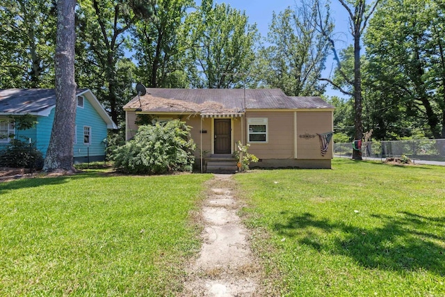 view of front of property with a front lawn