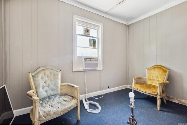 sitting room with carpet flooring, cooling unit, and crown molding