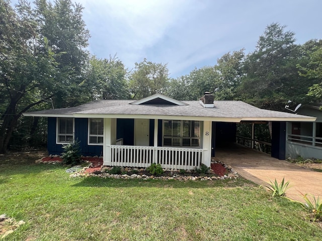 single story home with a front lawn and a carport