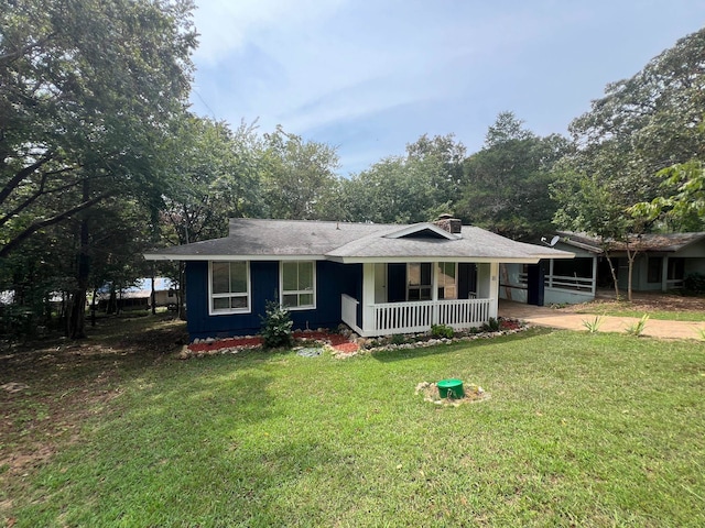 ranch-style home with a front lawn