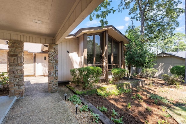 property entrance featuring a patio area