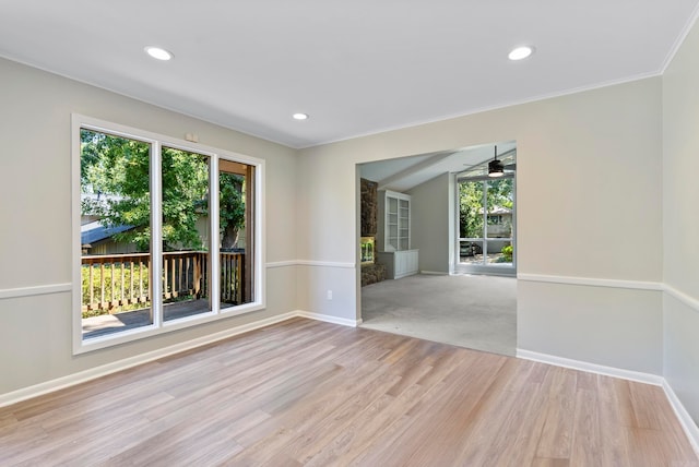 unfurnished room with ceiling fan, carpet, and crown molding