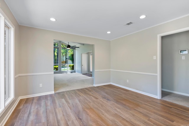 spare room with carpet floors and ceiling fan