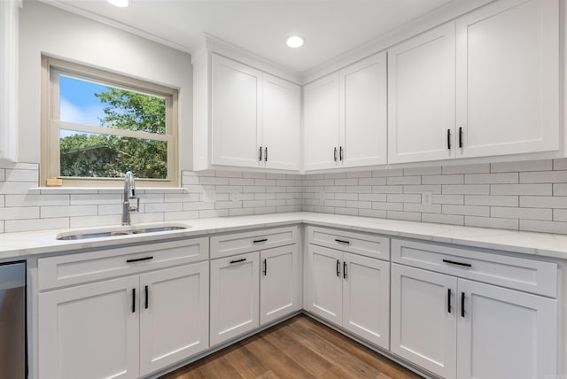 kitchen featuring sink, white cabinets, dark hardwood / wood-style flooring, and tasteful backsplash