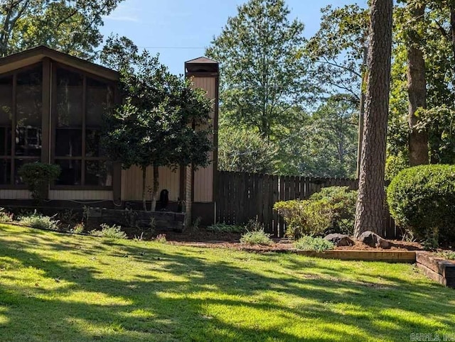 view of yard featuring a sunroom