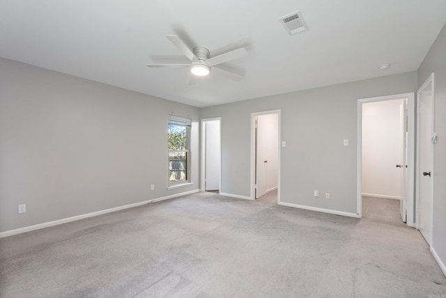 unfurnished bedroom featuring ceiling fan and light carpet