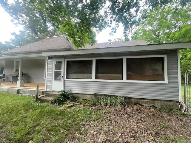 view of property exterior featuring roof with shingles