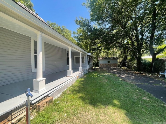 view of yard featuring covered porch